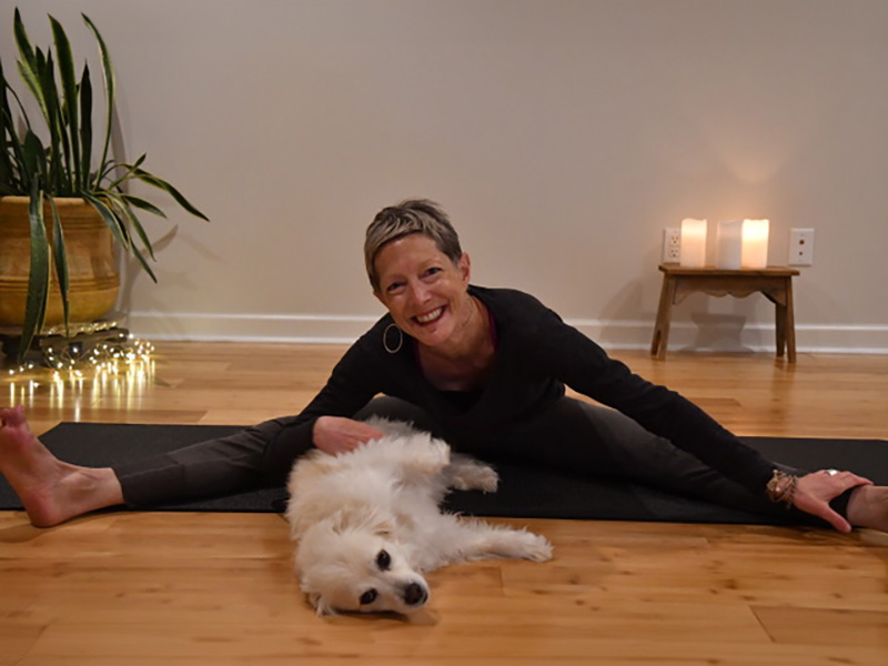 Paige Gilchrest, Asheville Yoga Center Instructor with her dog